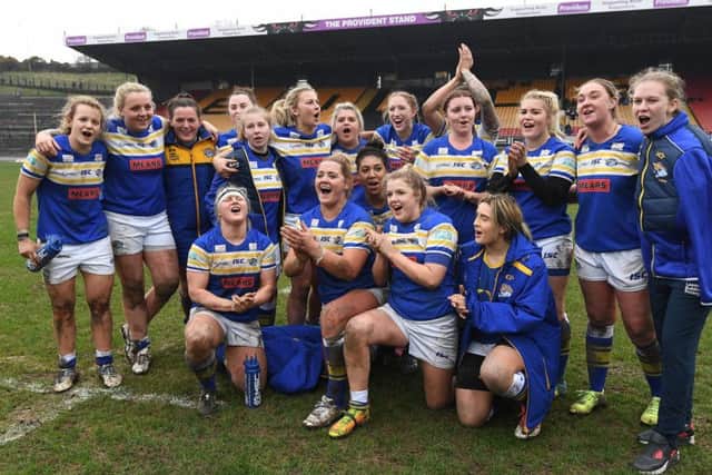 Leeds Rhinos' women's team celebrate their victory over Bradford Bulls women's team.