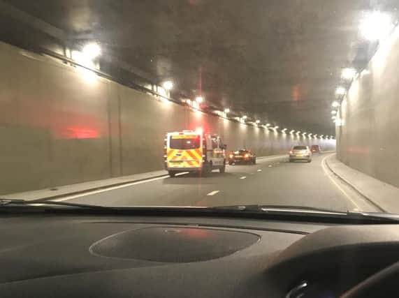 The broken down car in the tunnel
