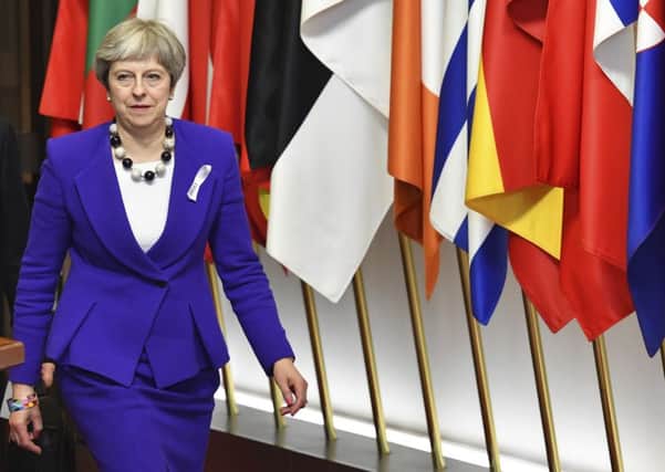 Theresa May leaves an EU summit in Brussels last month.