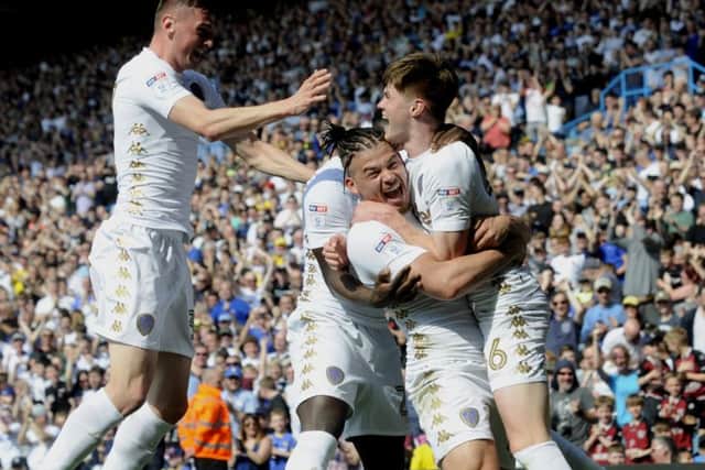 MOMENT TO SAVOUR: Leeds United's Tom Pearce is hugged by Kalvin Phillips after scoring his first goal for Leeds United. Picture by Simon Hulme.