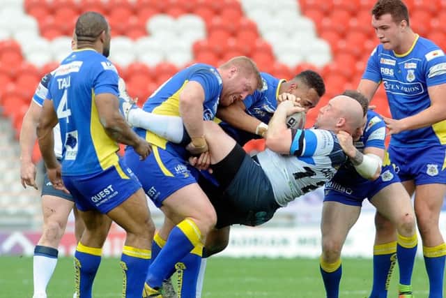 Doncaster's defence stands strong against John Davies, of Featherstone. PIC: Simon Hulme