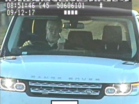 Timothy Hill, pictured making a rude gesture at a police speed camera van, has been jailed