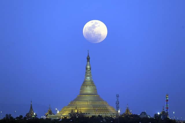 The moon rises above the Uppatasanti Pagoda seen from Naypyitaw, Myanmar, Wednesday, Jan. 31, 2018. (AP Photo/Aung Shine Oo)