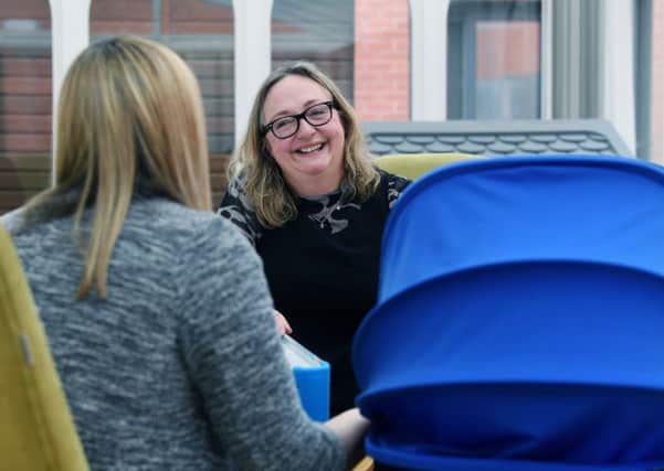 A pioneering Leeds unit which helps new mums dealing with post-natal depression. Pictured Bronwen Ashton, who was a service user and is now a volunteer, helping others going through a difficult time with their babies.