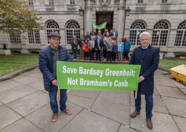 Date: 26th April 2018.
Picture James Hardisty.
Protesters from Bardsey Action group outside Leeds Civic Hall demonstrating over the plans that 140 homes are to be build on greenbelt land in the village. Pictured Resident of Bardsey (left to right) Gabriel Barreto, and Des Hatfield, holding a banner ' Save Bardsey Greenbelt' whilst campaigners look-on.