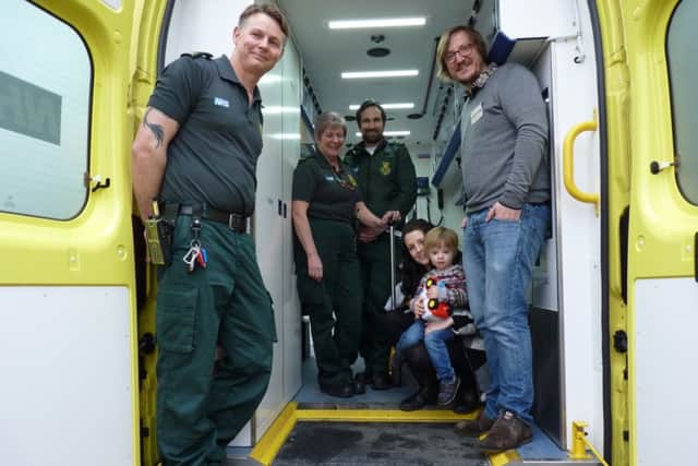The Bavill family with the lifesaving ambulance crew.