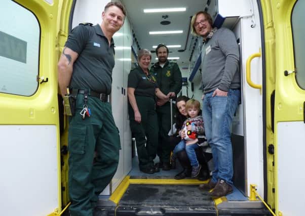 The Bavill family with the lifesaving ambulance crew.