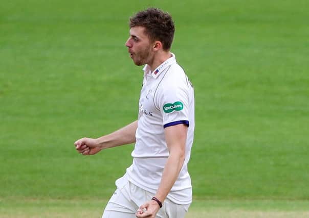 Yorkshire's Ben Coad celebrates the wicket of Notts' Steven Mullaney.