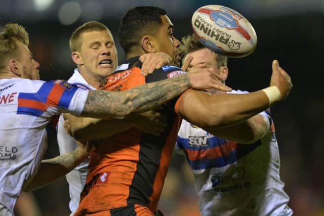 Castleford's Junior Moors loses the ball.