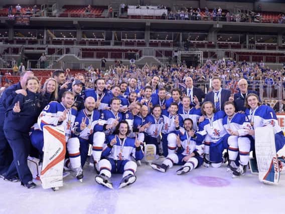GB's players celebrate winning gola and promotion to the top tier of the world game for the first time since 1994. Picture: Dean Woolley.