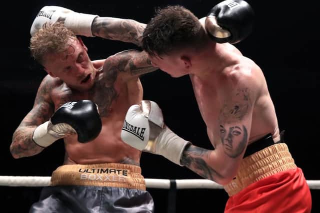 Drew Brown (right) and Tom Young compete in the final of the Ultimate Boxxer competition at the M.E.N. Arena, Manchester. PIC: Peter Byrne/PA Wire