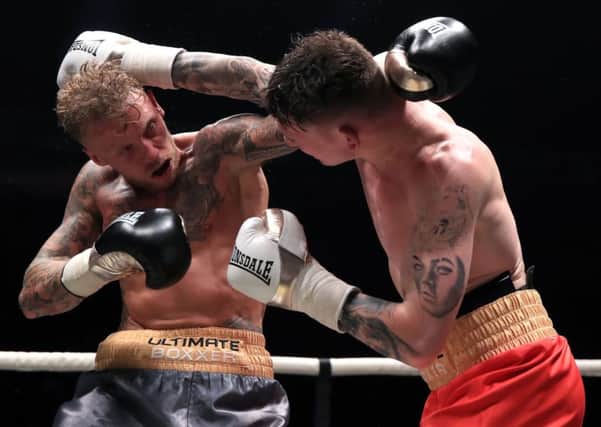 Drew Brown (right) and Tom Young compete in the final of the Ultimate Boxxer competition at the M.E.N. Arena, Manchester. PIC: Peter Byrne/PA Wire