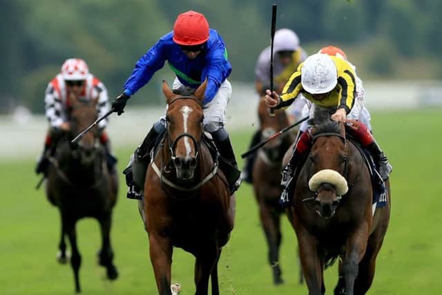 James Garfield, right, ridden by Frankie Dettori. PIC: Tim Goode/PA Wire