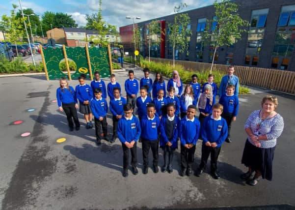 Children from  Little London Community Primary School, Leeds, with teachers. PIC: James Hardisty/YPN