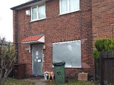 Floral tributes placed outside the house on Ambleside Road.