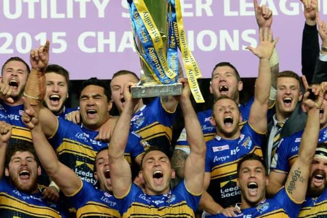 Leeds Rhinos captain Kevin Sinfield lifts the trophy after winning the 2015 Super League trophy. PIC: Anna Gowthorpe/PA Wire