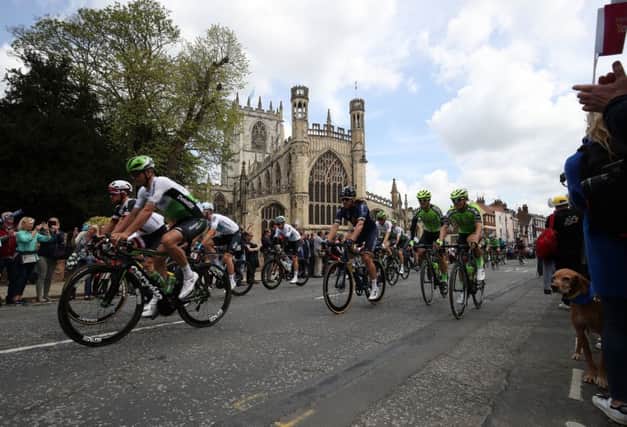 Riders pass by the Parish Church of St Mary, Beverley, in the Men's Race, during day one of the Tour de Yorkshire from Beverley to Doncaster.