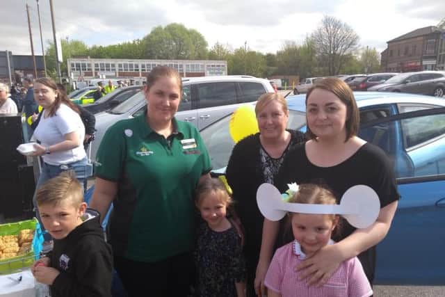 Maria Bowers (green t-shirt) from Morrisons was giving away free food and drink to celebreate the event.