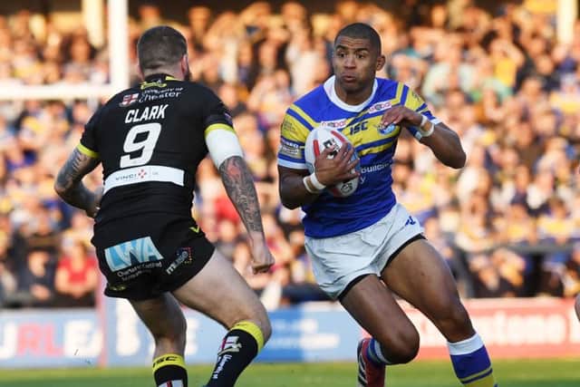 OUT OF THE WAY: Leeds Rhinos' captain Kallum Watkins takes on Wolves Daryl Clark.
Picture: Jonathan Gawthorpe