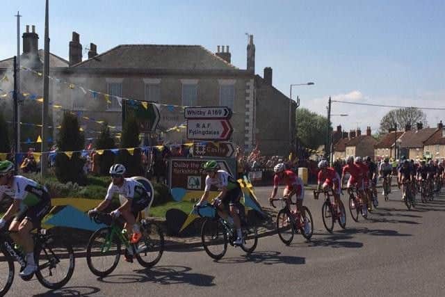 The riders pass through Pickering