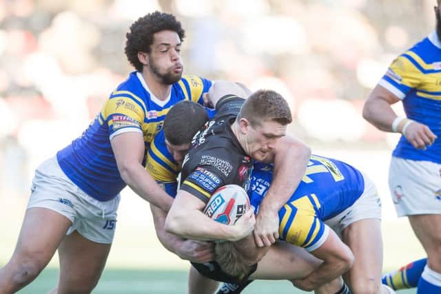 Ed Chamberlain is tackled by Josh Walters, Mitch Garbutt and Jack Ormondroyd.