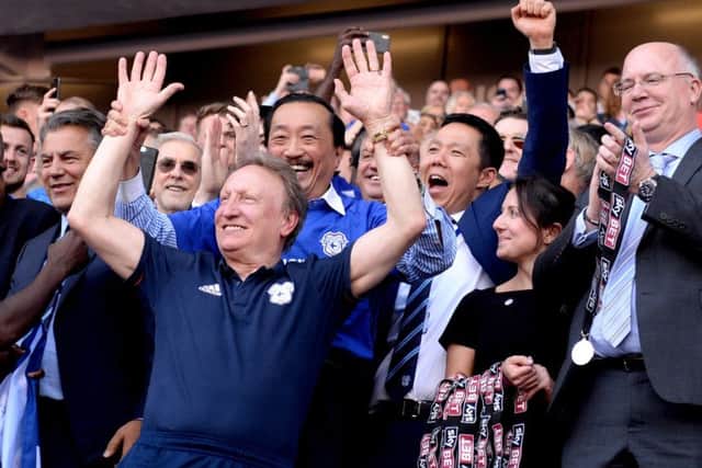 Cardiff City manager Neil Warnock celebrates his side's promotion to the Premier League on Sunday.