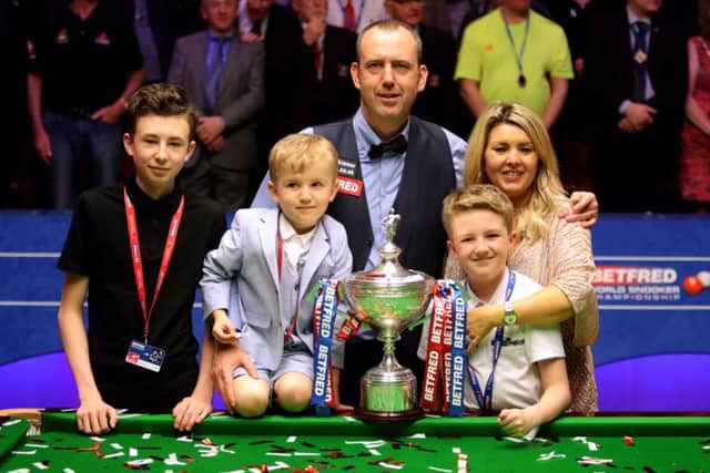 Mark Williams and his family with the trophy after winning the World Championship at the Crucible, Sheffield (Picture: Richard Sellers/PA Wire).