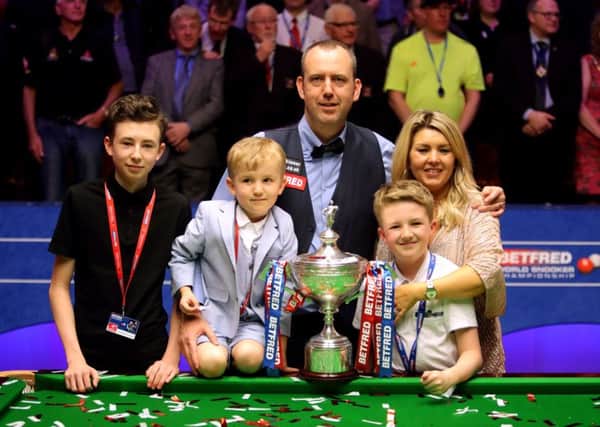 Mark Williams and his family with the trophy after winning the World Championship at the Crucible, Sheffield (Picture: Richard Sellers/PA Wire).