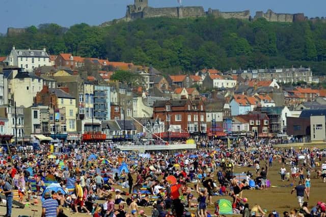 People enjoy the hot summer sun on the beach at South Bay in Scarborough on Monday. Picture by Simon Hulme