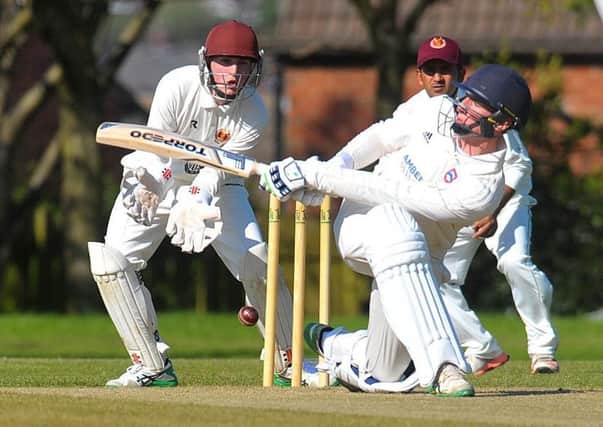 Pudsey Congs' batsman James Ford attempts to sweep against visitors Hartshead Moor. PIC: Steve Riding