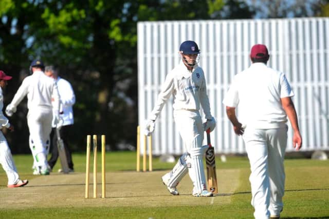 Pudsey Congs opener Barry Gibson is bowled by Hartshead bowler Danny Squire. PIC: Steve Riding