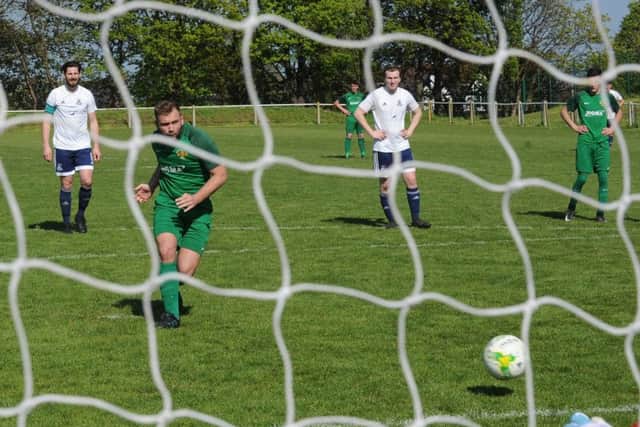 Beeston's Kingsley Wetherald finds the back of the net from the penalty spot. PIC: Steve Riding