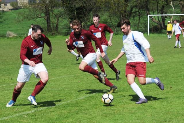 Jordan  Deacey, of Bardsey, takes on the Pudsey Athletic defence. PIC: Steve Riding