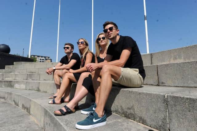 Tom Addy, Sarah Lane, Juliet Brine and Jonny Lane enjoying the sunshine at Leeds Dock as the May Bank Holiday broke temperature records. Picture: Scott Merrylees