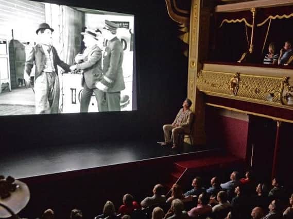 Paul Merton and the audience watch Charlie Chaplin at the City Varieties.