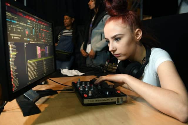 Jade practices her DJ skills.