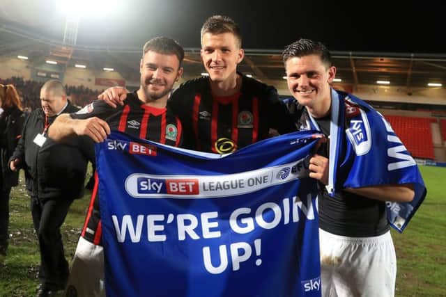 Blackburn Rovers' Marcus Antonsson (right) and team mates celebrate getting promoted.
