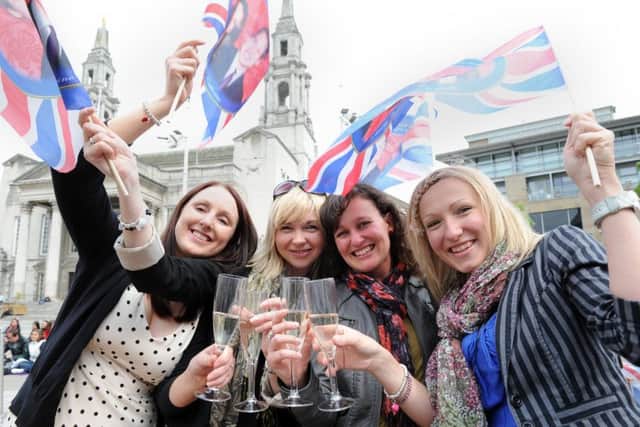 Revellers in Millennium Square toast the Duke and Duchess of Cambridge's wedding in 2011.