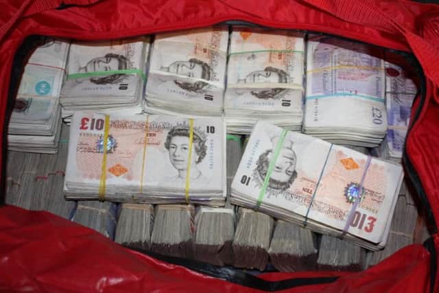 SEIZED: Fraud cash taken by officials investigating the operation.