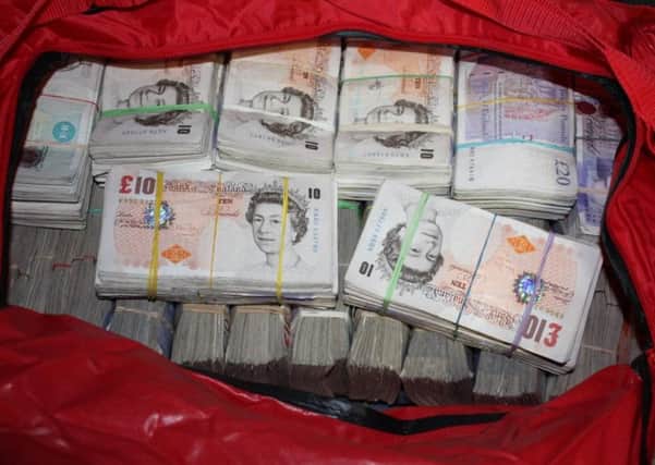 SEIZED: Fraud cash taken by officials investigating the operation.