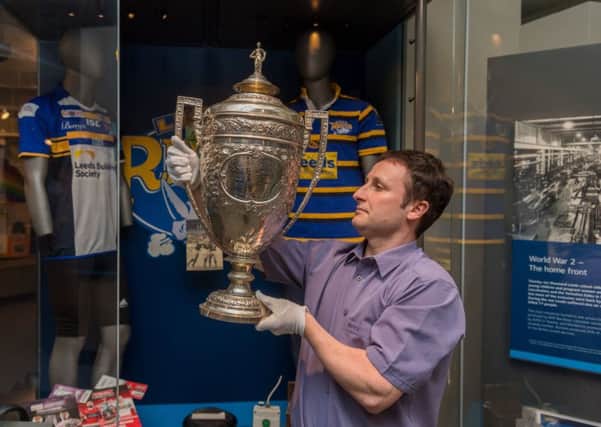 Richard Higson-Blythe, Site Development Officer at Leeds City Museum holds the Yorkshire Cup.