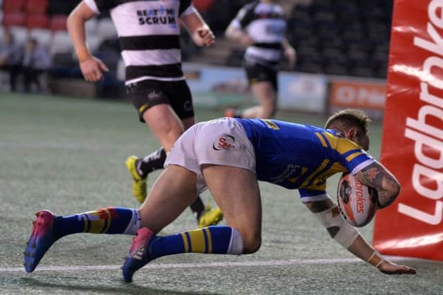 Richie Myler touches down for the  Rhinos' second try.