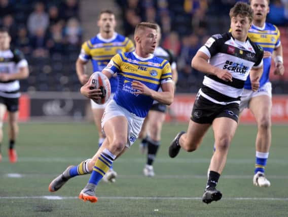 Jack Walker on the attack for Leeds against Widnes at Halton Stadium on Friday night. Picture: Bruce Rollinson