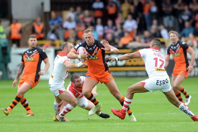 PUSHING THROUGH: Castleford Tigers' Liam Watts tries to engineer a move against St Helens. Picture: Tony Johnson.