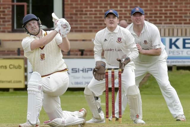 Jordan Laban hits a defiant six  for Methley in his innings of 67  against Cleckheaton.