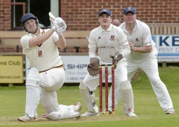 Jordan Laban hits a defiant six  for Methley in his innings of 67
  against Cleckheaton.