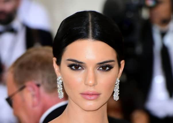 CELEBRITY GET THE LOOK: Kendall Jenner was at the Met Ball earlier this week in New York, showing us all how the classic combination of statement earrings and smokey eyes is still a winner. For the eyes, try the Illamasqua Complement Palette, Â£28. Picture: Ian West/PA Wire