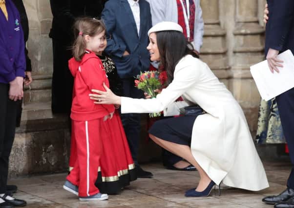 Radiant Royal-to-be, Meghan Markle talking to children as she leaves the Commonwealth Service at Westminster Abbey, London, in March. Photo credit: Yui Mok/PA Wire