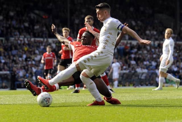 Andy Yiadom challenges Pablo Hernandez during Barnsley's 2-1 defeat to Leeds United last month.
