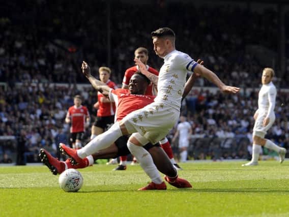 Andy Yiadom challenges Pablo Hernandez during Barnsley's 2-1 defeat to Leeds United last month.